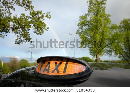 London Black Taxi Cab and Rainbow