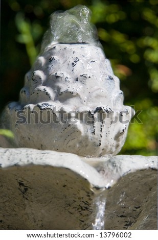Garden fountain with water spouting