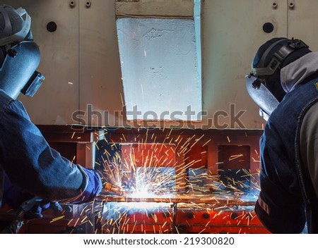 Team work welder steel in Industrial