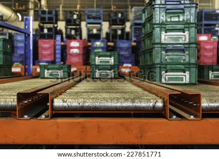package boxes on industrial conveyor line.