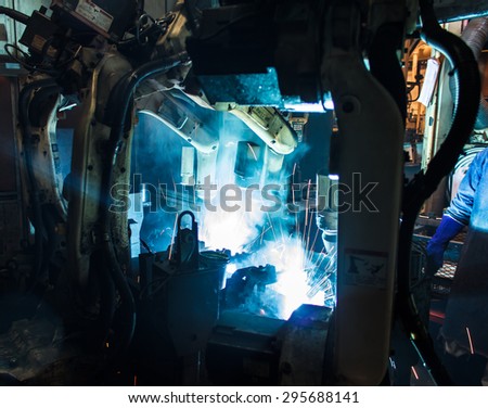Welding robots movement in a car factory
