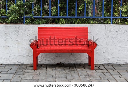 Red park bench in the park.