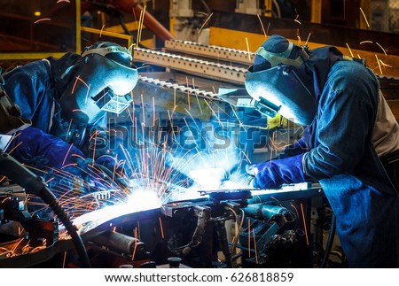 worker with protective mask welding metal  (welding, welder, steel)