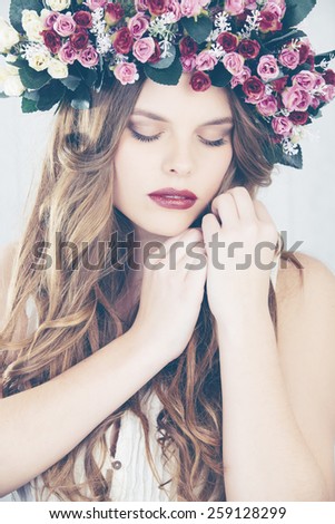 Beautiful girl with flower wreath