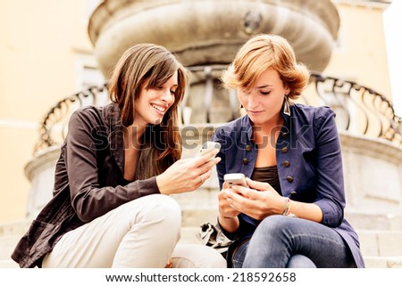 Women using mobile phone. Social Networking.