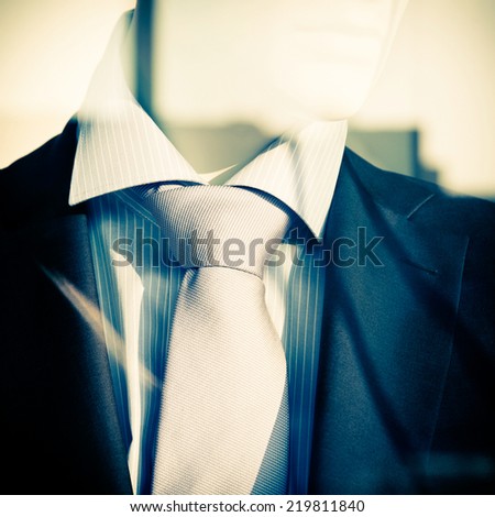 Portrait of a male Mannequin Wearing elegant Clothing. Reflection from the window.
