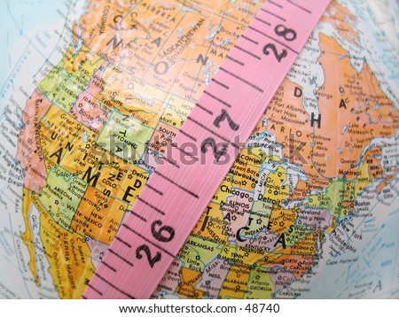 Measure tape over a globe.
