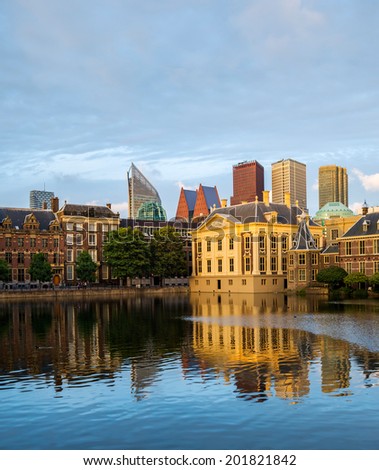 The Hague (Den Haag) skyline with Mauritshuis Museum, Het Torentje, and modern skyscrapers reflected in the Hofvijver canal, The Netherlands.