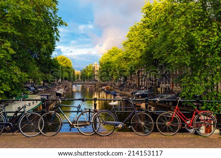 Bicycles Parked Along a Bridge Over the Canals of Amsterdam, Netherlands
