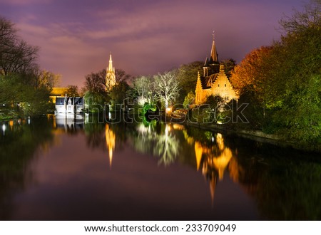 Night View of the Minnewater Lake (Lake of Love) in Bruges, Belgium.