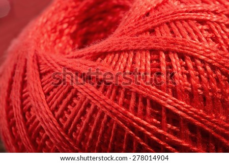 close up of skein of red thread