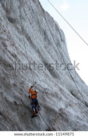 a man-climber rises on the icy wall