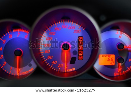 car panel instrument with blue speedometer and tachometer
