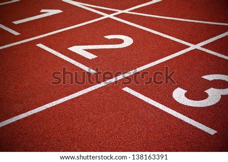 Athletics Start track lanes 1 2 3 of a red running racing track