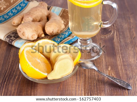 Hot ginger lemon tea in glass