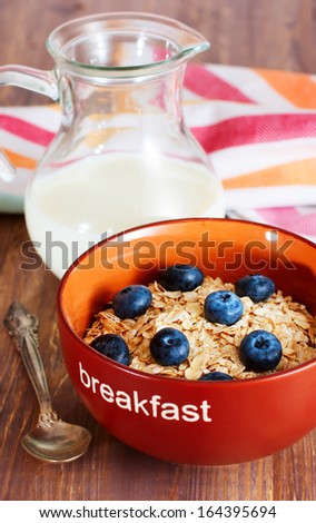 Healthy breakfast with bowl of oat flakes