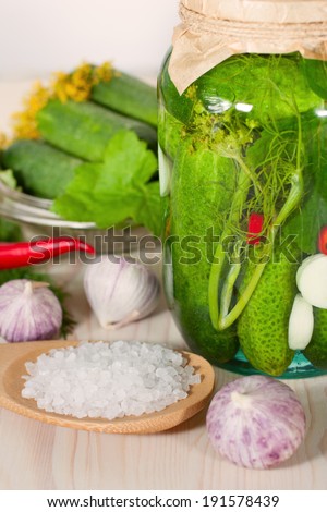 Pickling cucumbers. Wooden background
