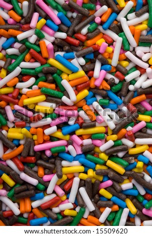 Background of colorful sprinkles, jimmies for cake decoration or icecream topping