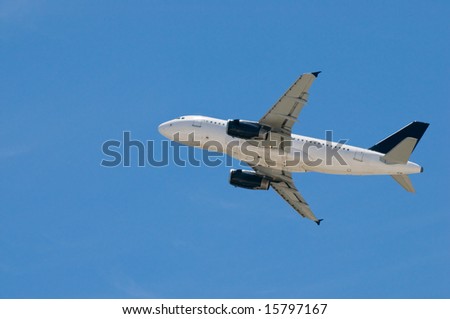 Commercial airplane taking off, against clear blue sky