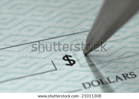 Closeup of ballpoint pen writing on a blank bank check, ready to fill in the dollar amount; selective focus on the tip of the pen, very shallow DOF