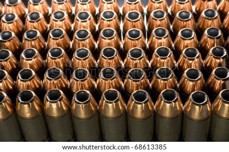 Hollow point handgun cartridges that are lit from behind