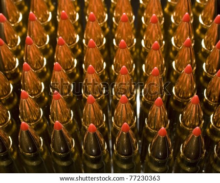 shells with copper plated bullets and red polymer tips