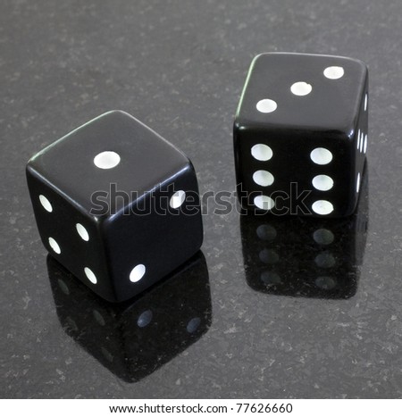 a pair of dice that have rolled the number four