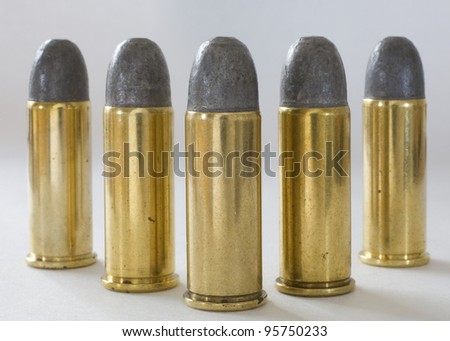 Five cartridges with lead bullets made for 44 special guns