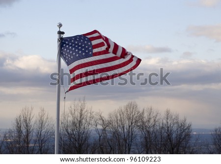 American flag in the breeze on a mountain over the Shenandoah Valley