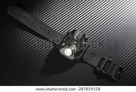 Flashlight meant for use with a gun that mounts on a wrist