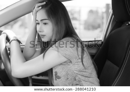 Stressed woman driver black and white