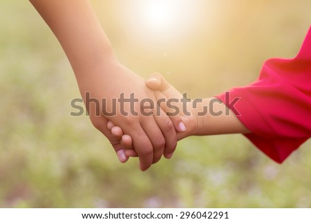 children holding hands sunlight,happy