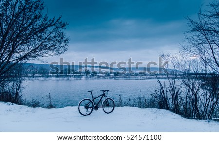 Cycling on lake. Winter