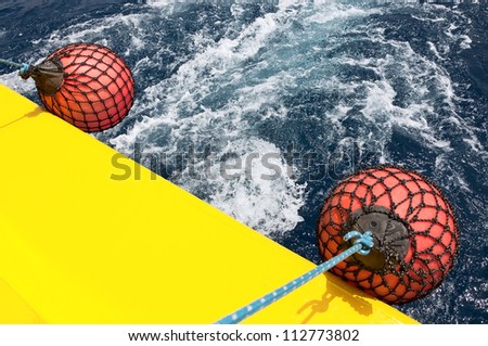 Round mooring fender on-board the ship