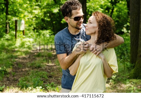 http://image.shutterstock.com/display_pic_with_logo/1982345/417115672/stock-photo-guy-and-the-girl-walking-in-nature-man-and-woman-on-a-picnic-or-excursion-enjoying-the-beautiful-417115672.jpg