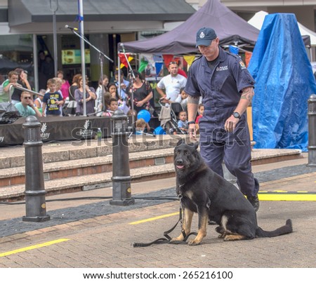 Auckland, New Zealand , March 28, 2015 : The police officer with police dog are ready to perform an attack demonstration in Auckland, New Zealand
