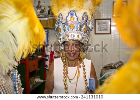 Older Woman wearing hat, preparation for Carnival Parade. 1 March 2014 Bonfim Paulista Ribeirao Preto Sao Paulo Brazil