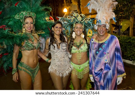 Three women and one man in Carnival Parade, Brazil. 1 March 2014 Bonfim Paulista Ribeirao Preto Sao Paulo Brazil