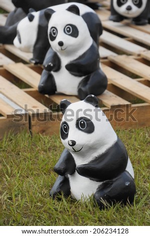 Nantou, Taiwan - July 20,2014: 1600 Pandas World Tour in  Chung-hsing New Village, Taiwan. Part of pandas world tour are designed by French artist Paolo Grangeon. Some pandas wear Taiwan bamboo hats.