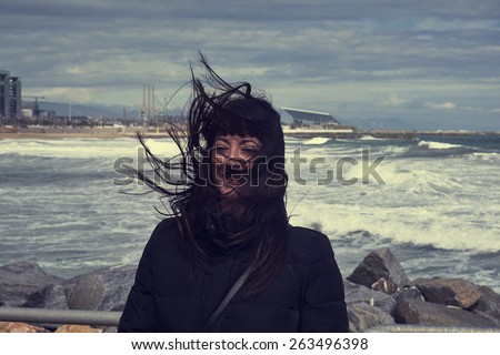 Woman with hair blowing in the wind