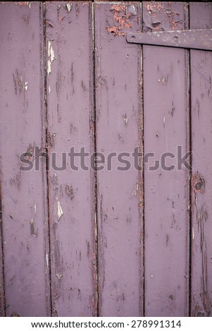 Cracked paint texture on an old wooden door
