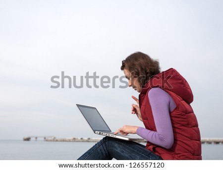 Woman working on the laptop outdoor