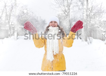 Woman play with snow in winter