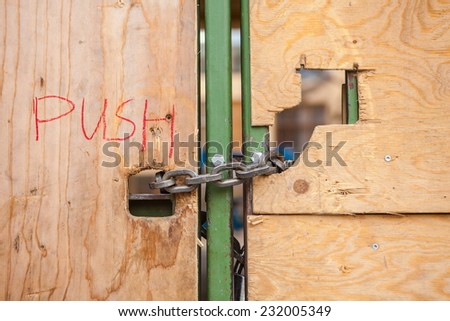 Closed wooden door with the inscription - push