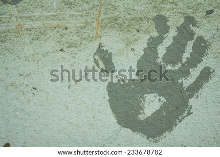 Handprint on the builder of the walls of the building