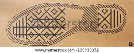 imprint soles shoes - sneakers on cardboard background