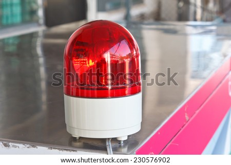 Red siren/light in factory.
