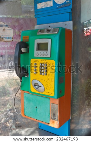 Old public telephone Coin orange and green color