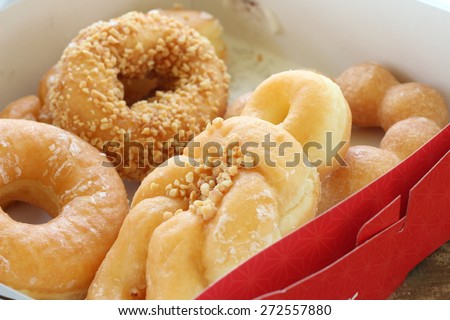Set of delicious donut in paper box