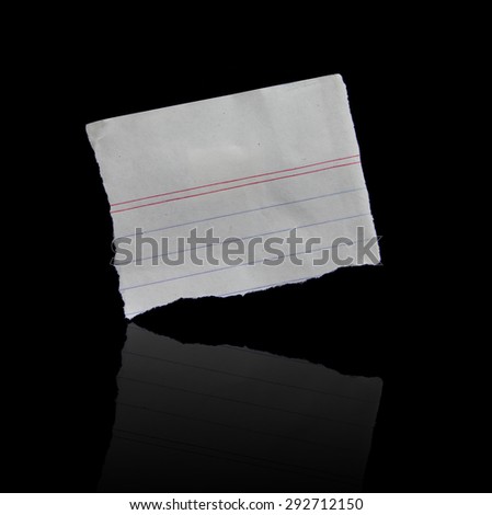 Torn pieces of paper on black background